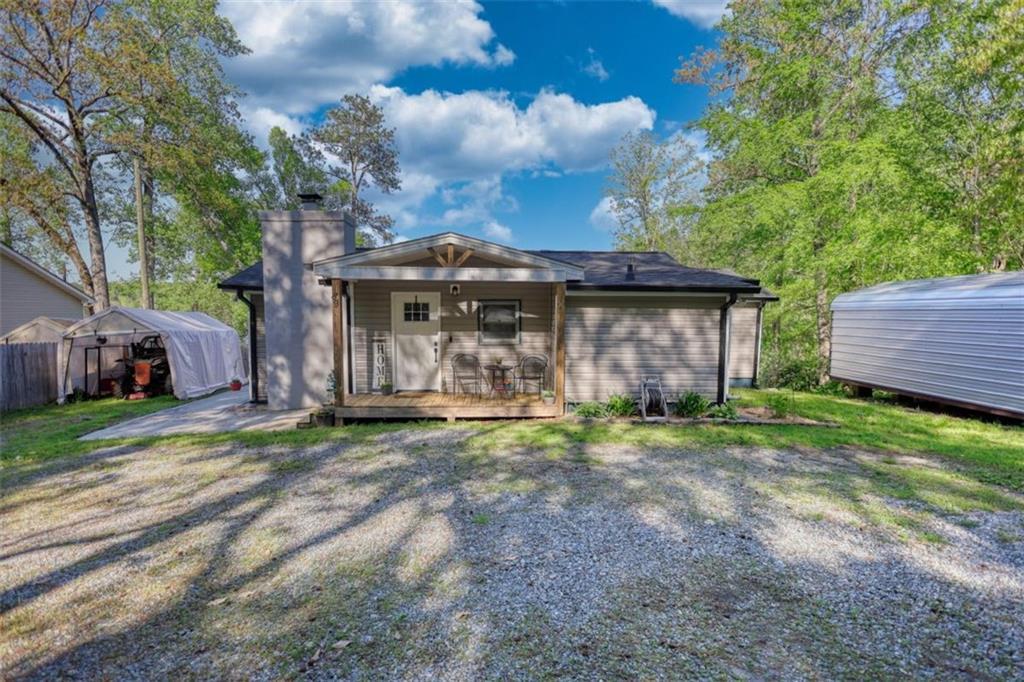 89 Miss Sarah Road Monticello, GA 31064 - Photo 69 of 77 a view of a house with a yard and large tree