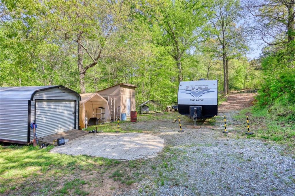 89 Miss Sarah Road Monticello, GA 31064 - Photo 71 of 77 a front view of a house with garden