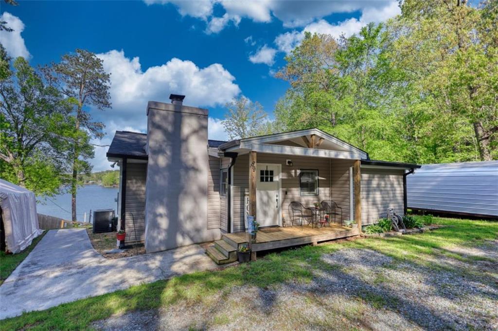 89 Miss Sarah Road Monticello, GA 31064 - Photo 75 of 77 a view of a house with a small yard and a large tree
