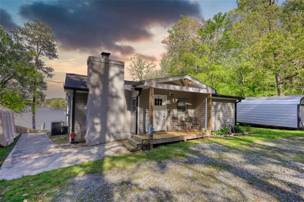 89 Miss Sarah Road Monticello, GA 31064 - Photo 77 of 77 a view of a house with brick walls and a yard with plants
