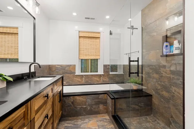 a bathroom with a sink and a mirror