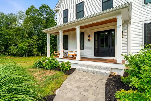 front view of a house with a yard
