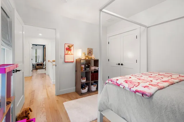 a bedroom with a bed and a walk in closet