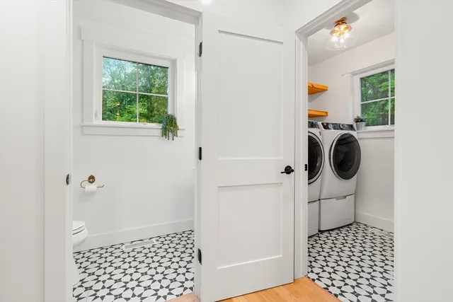 a bathroom with a sink a toilet and a shower