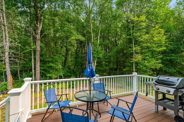 a view of a chair and table on the deck