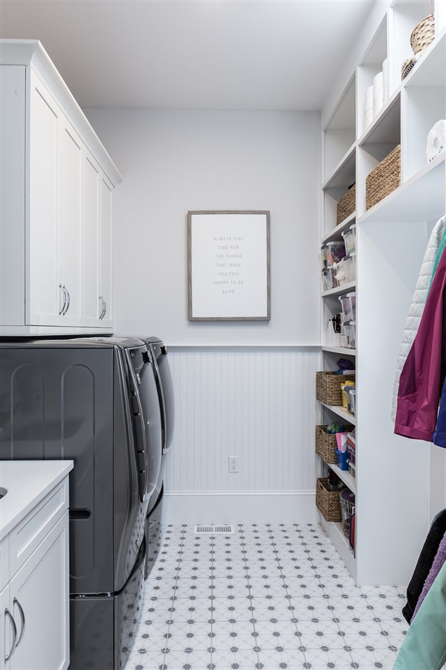 5417 Winding View Lane Raleigh, NC 27615 - Photo 7 of 30 One of two laundry rooms - the second is upstairs - this functional room has plenty of storage and a spot for a second refrigerator. Utility room