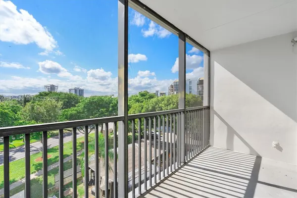 a view of a balcony with wooden floor
