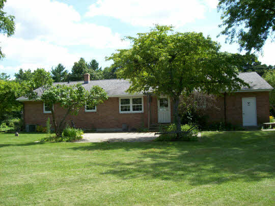 5685 Tipple Road Rockford, IL 61102 - Photo 4 of 4 a front view of house with yard and green space
