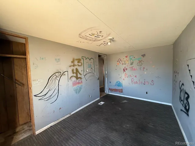a view of room with stairs and wooden floor