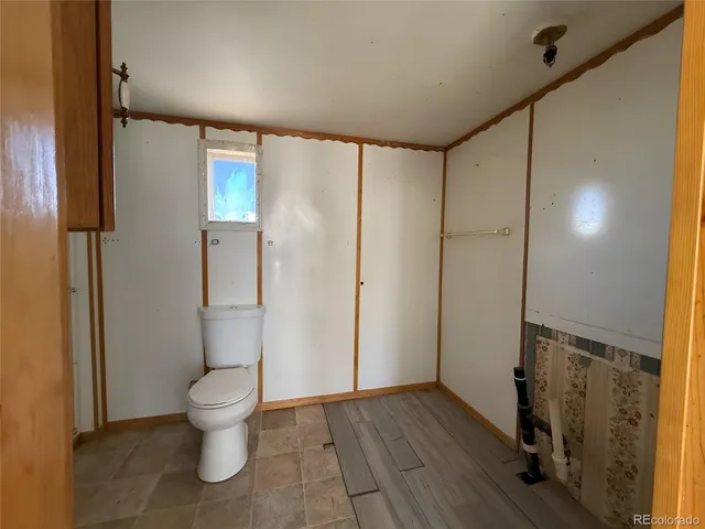 a bathroom with a glass shower door