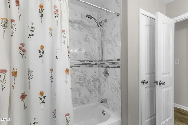 a bathroom with a shower curtain