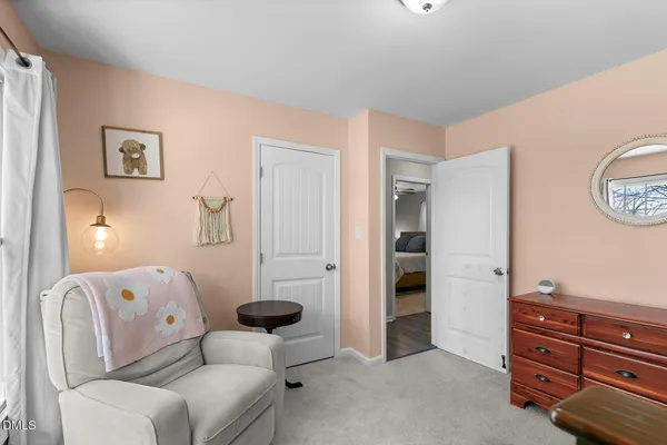 a living room with furniture and a closet