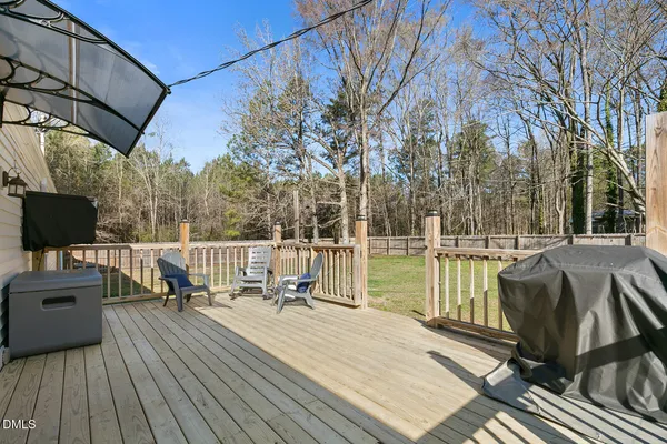 a view of balcony with couch and trees