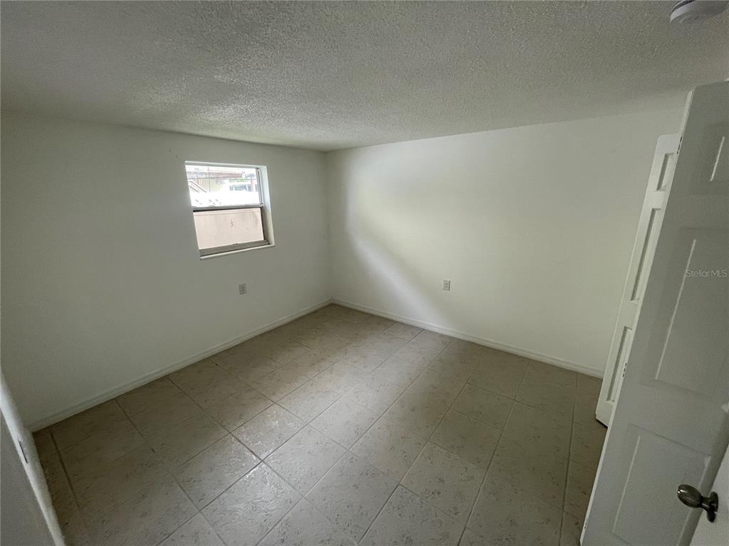 5311 Avery Road New Port Richey, FL 34652 - Photo 12 of 34 an empty room with a window