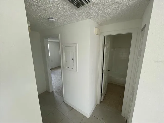 a view of an empty room with a bathroom