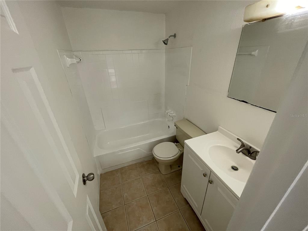 5311 Avery Road New Port Richey, FL 34652 - Photo 21 of 34 a bathroom with a sink toilet and shower
