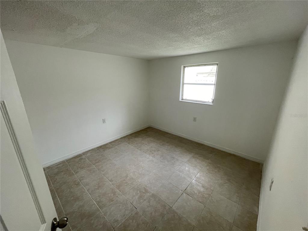 5311 Avery Road New Port Richey, FL 34652 - Photo 25 of 34 an empty room with a window