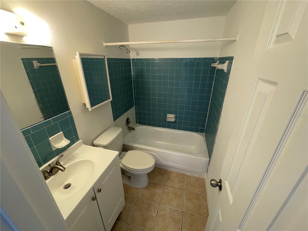 5311 Avery Road New Port Richey, FL 34652 - Photo 30 of 34 a bathroom with a sink toilet and shower