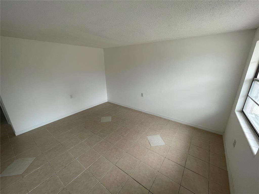 5311 Avery Road New Port Richey, FL 34652 - Photo 6 of 34 an empty room with a bathroom