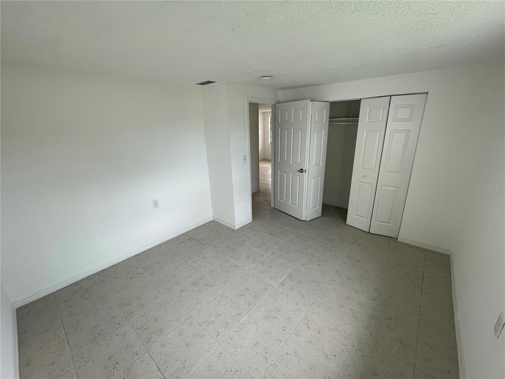 5311 Avery Road New Port Richey, FL 34652 - Photo 8 of 34 a view of an empty room and closet area