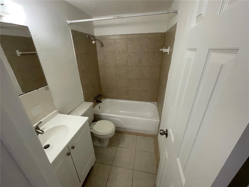 5311 Avery Road New Port Richey, FL 34652 - Photo 10 of 34 a bathroom with a sink a toilet and shower