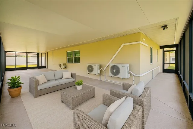 a living room with furniture and white walls