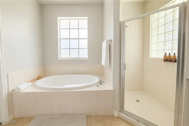 a white bath tub sitting next to a window