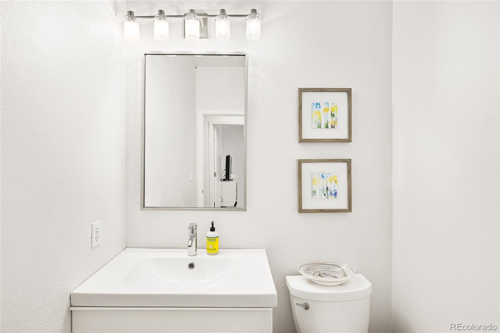 1947 King Street Denver, CO 80204 - Photo 11 of 40 a bathroom with a sink and a toilet