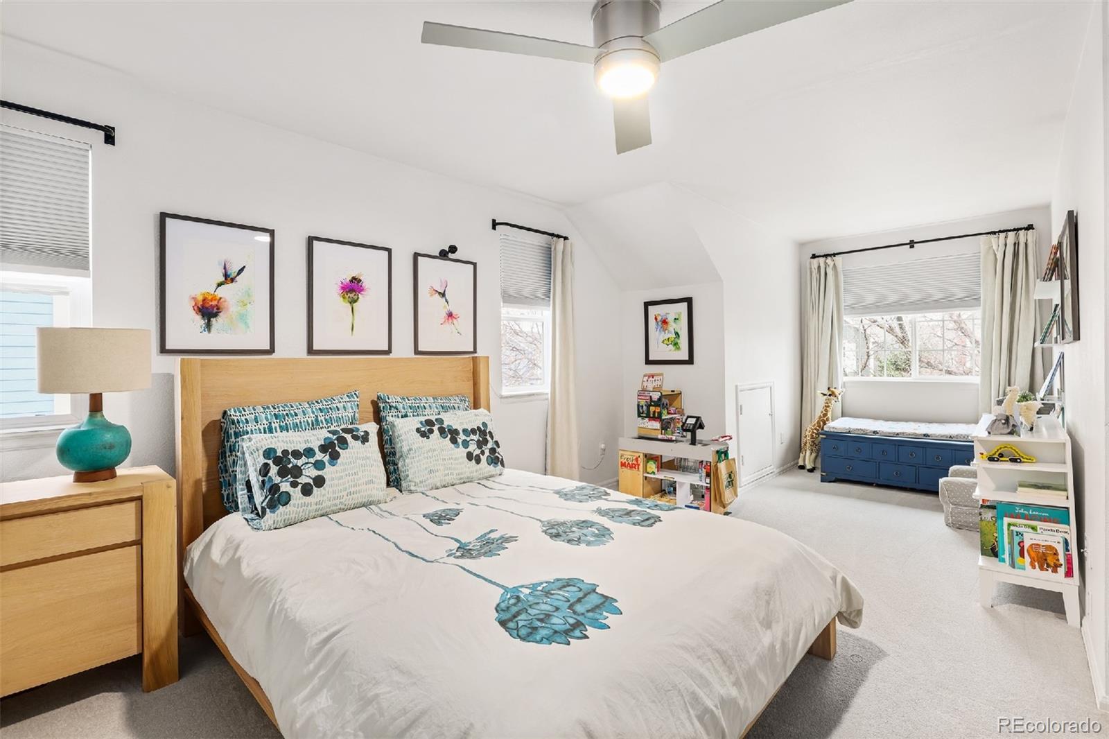 1947 King Street Denver, CO 80204 - Photo 15 of 40 a bedroom with a bed and a chandelier