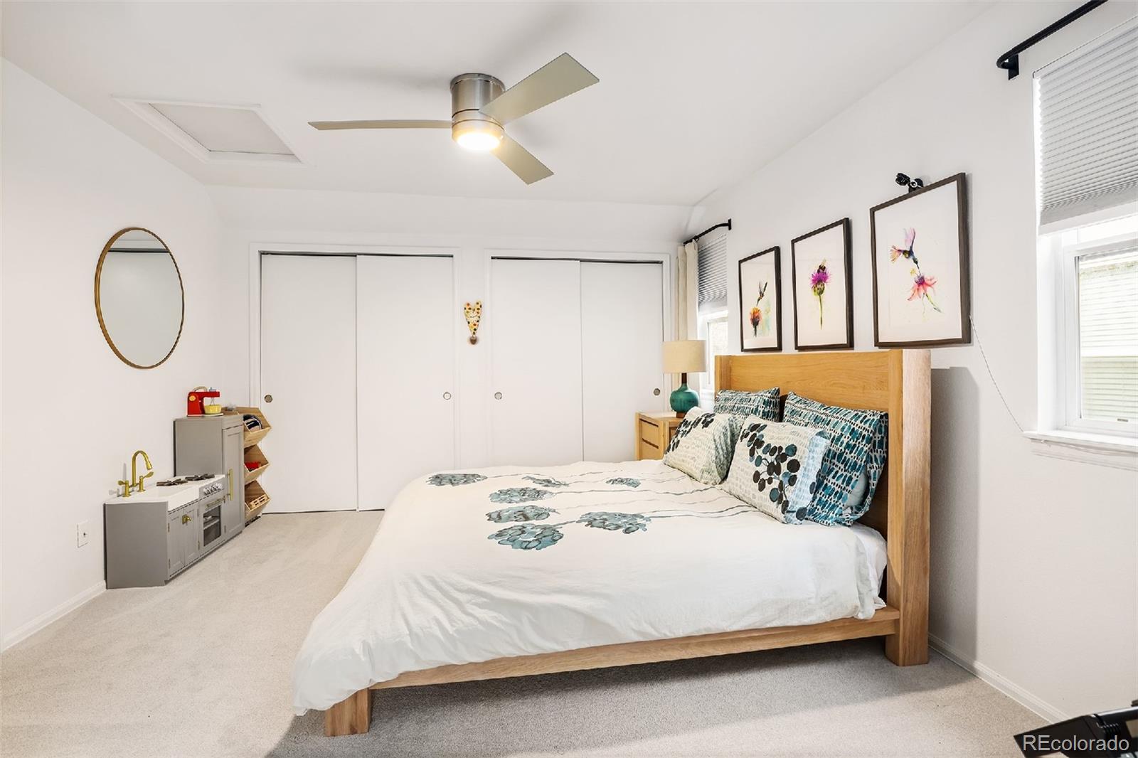 1947 King Street Denver, CO 80204 - Photo 16 of 40 a bedroom with a bed and a chandelier
