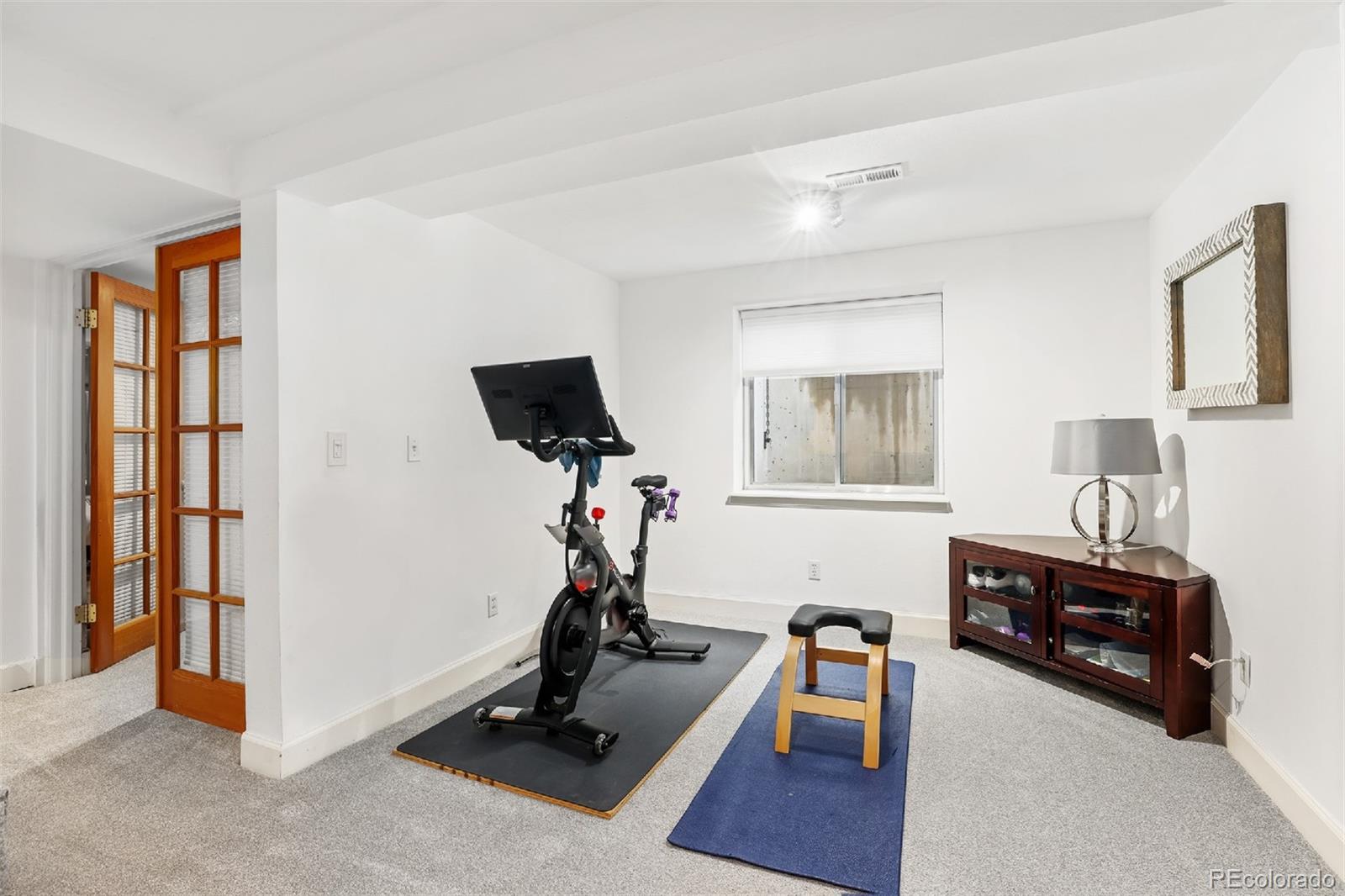1947 King Street Denver, CO 80204 - Photo 23 of 40 a view of a livingroom with workspace and a window