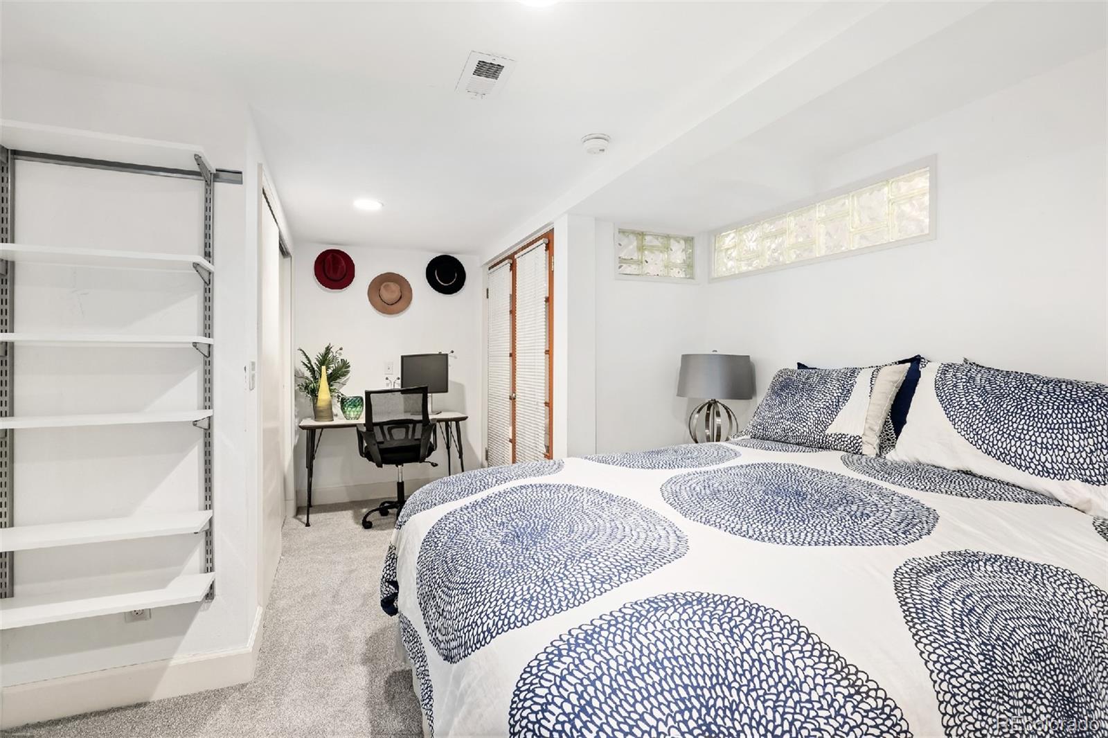 1947 King Street Denver, CO 80204 - Photo 25 of 40 a large bedroom with a large bed couch and a window