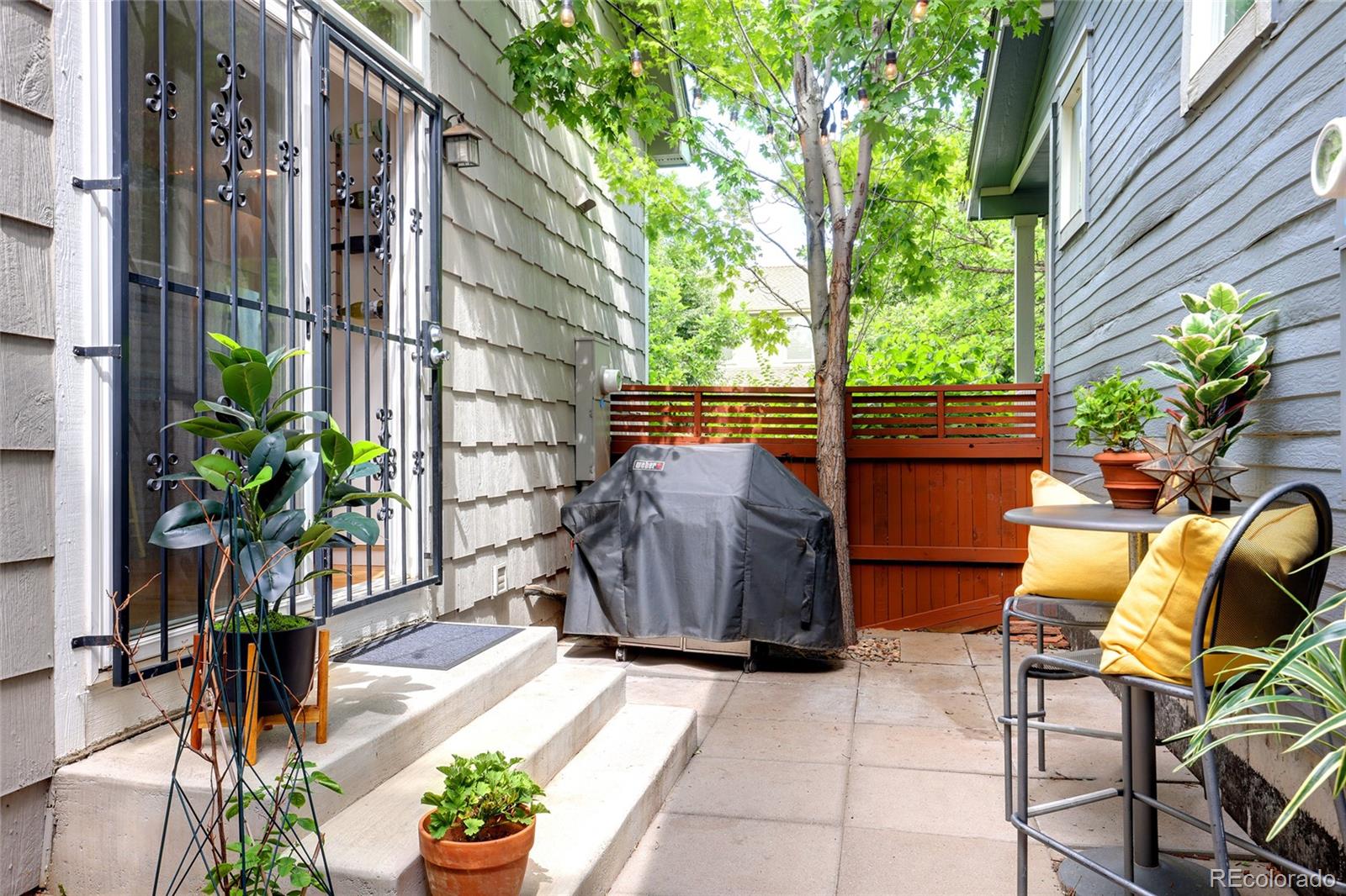 1947 King Street Denver, CO 80204 - Photo 30 of 40 a backyard of a house with outdoor seating