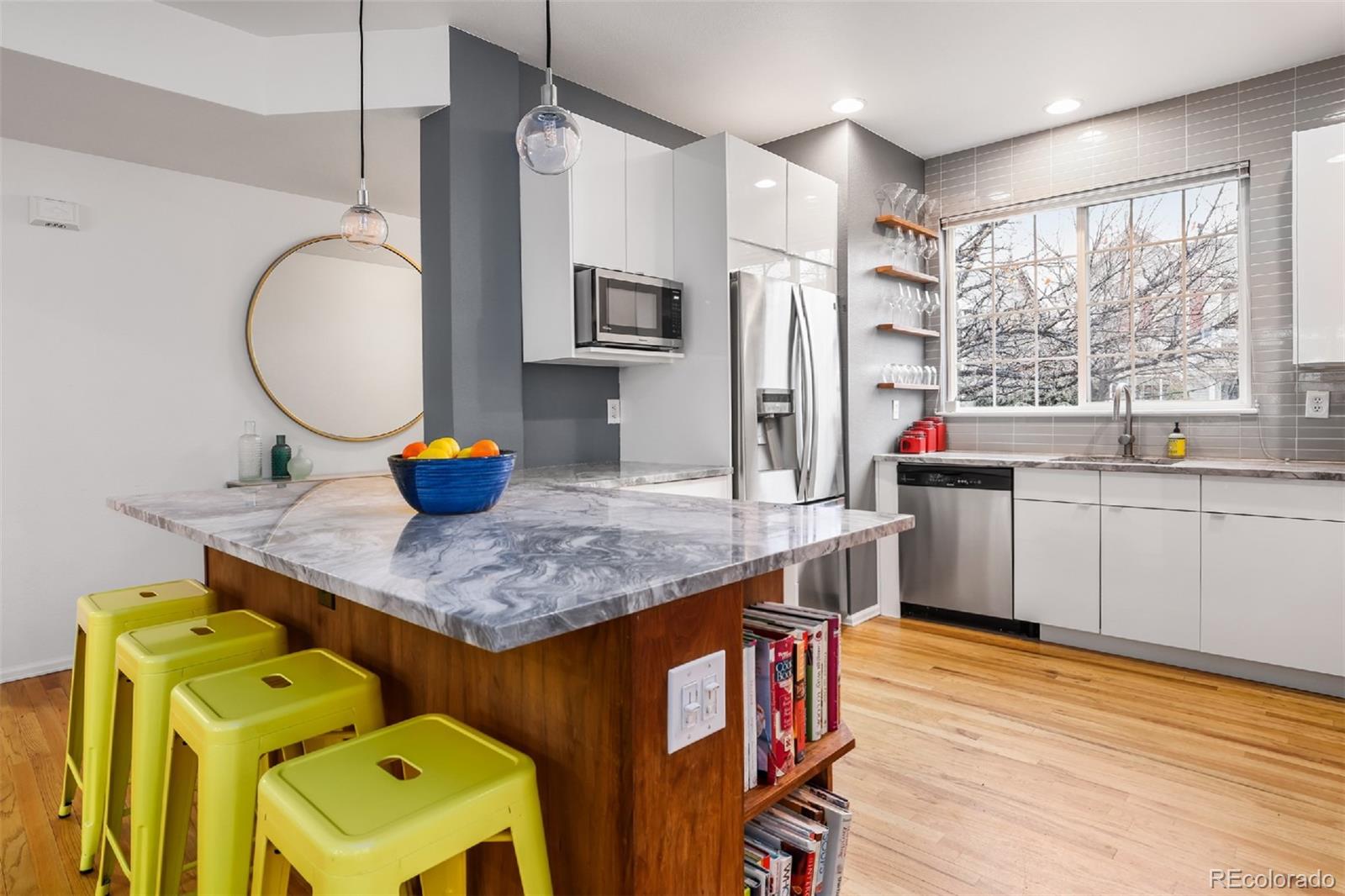 1947 King Street Denver, CO 80204 - Photo 4 of 40 a kitchen with a sink a stove and cabinets