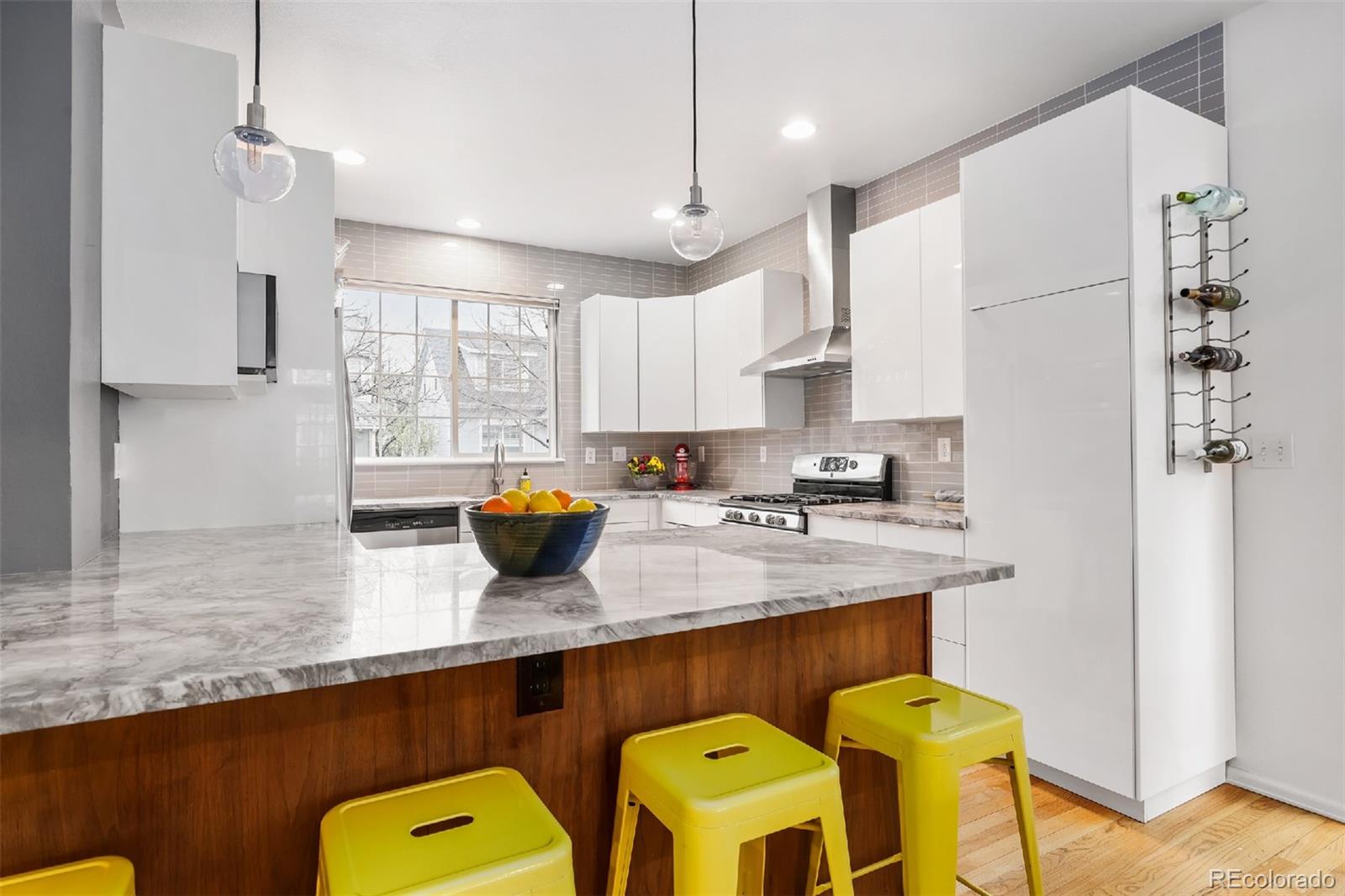 1947 King Street Denver, CO 80204 - Photo 5 of 40 a kitchen with table chairs cabinets and appliances