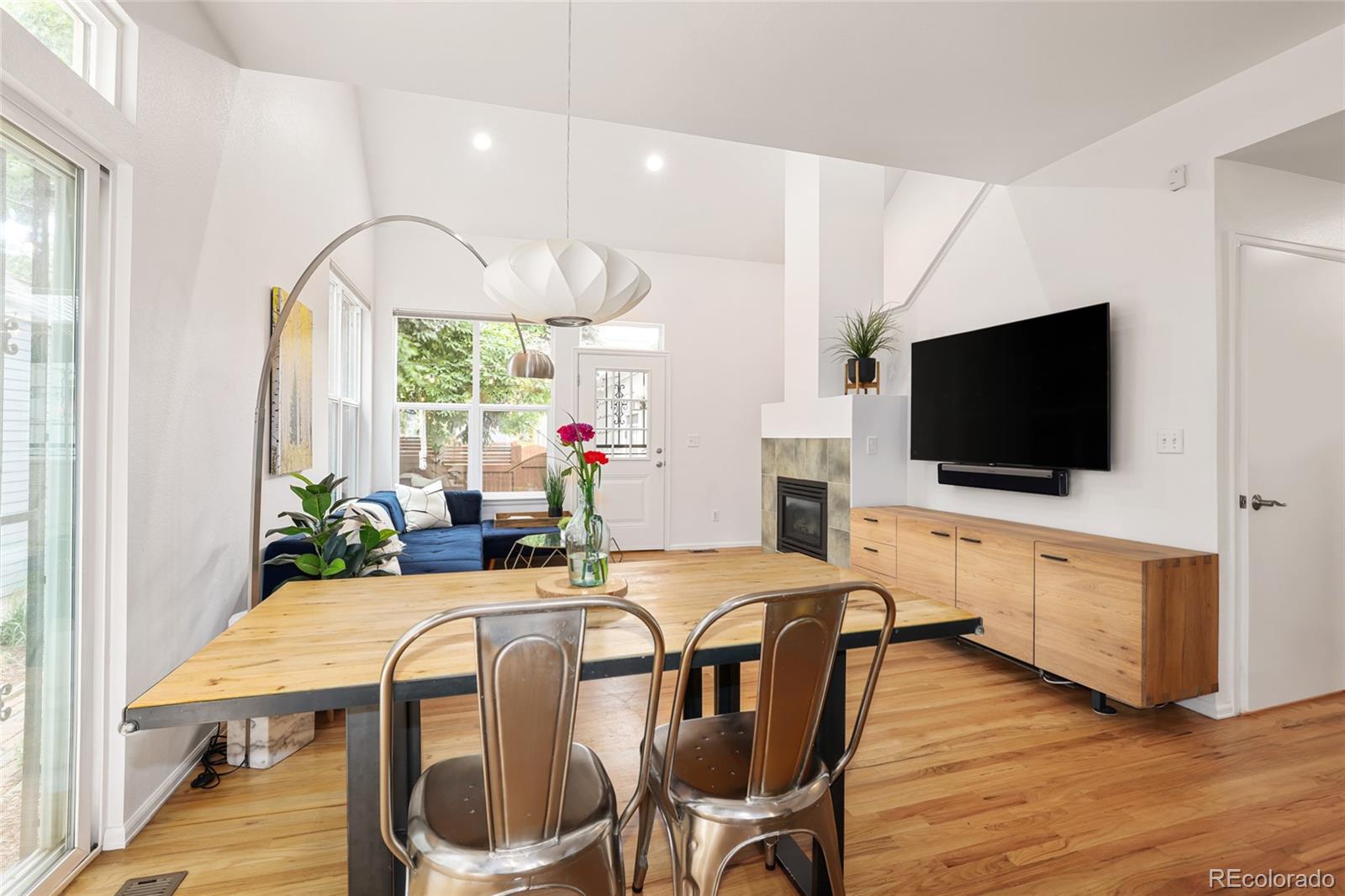 1947 King Street Denver, CO 80204 - Photo 7 of 40 a living room with furniture flat screen tv and wooden floor