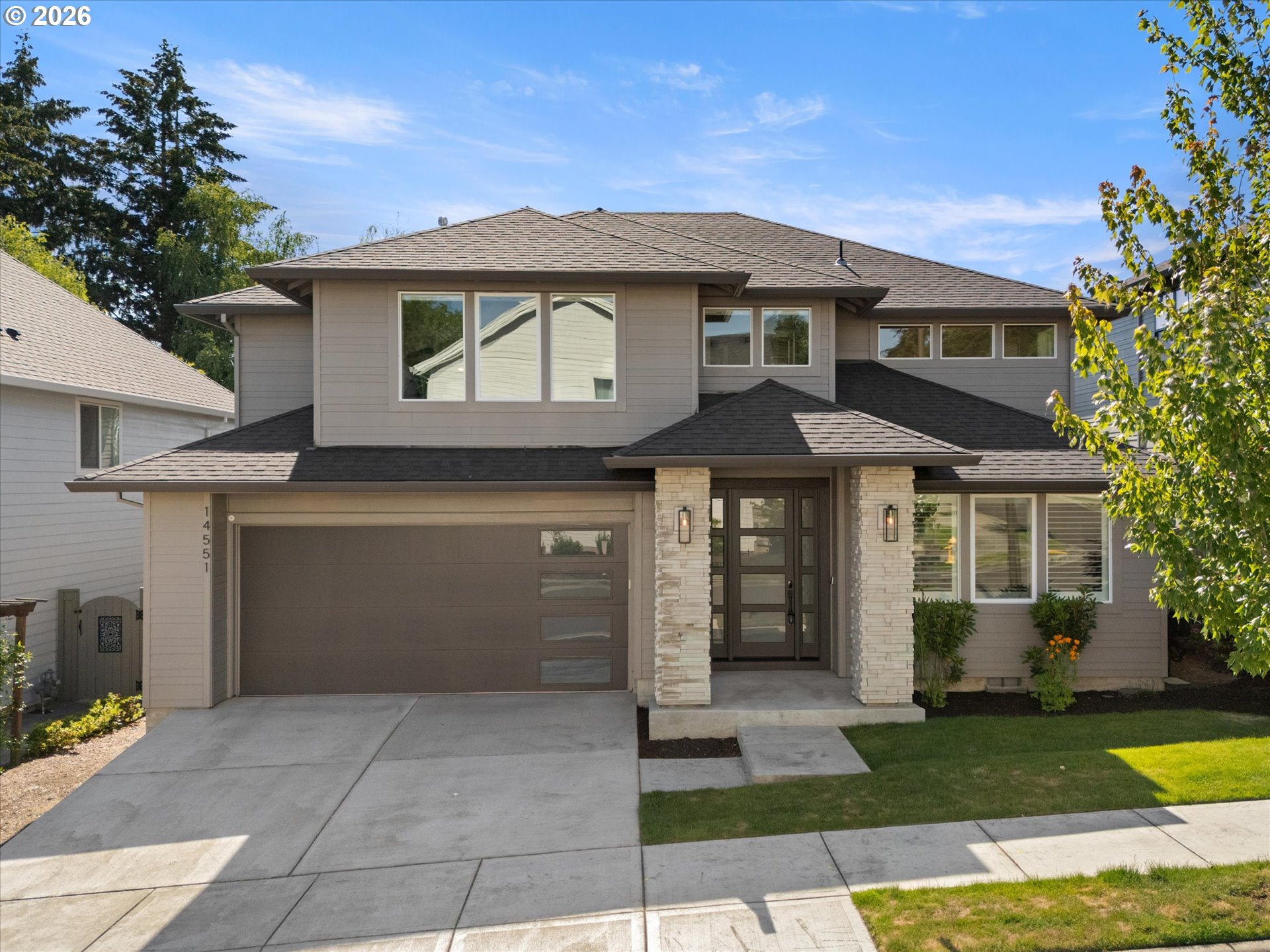 14551 Southwest 153rd Avenue Portland, OR 97224 - Photo 1 of 45 a front view of a house with a garden and yard
