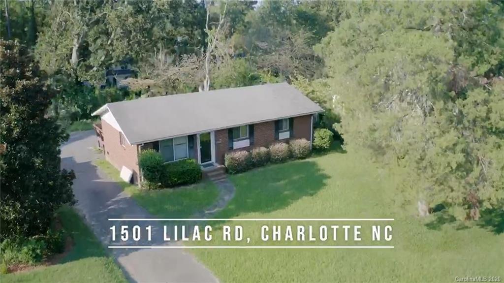 1501 Lilac Road Charlotte, NC 28209 - Photo 2 of 21 a view of a sign in front of a house