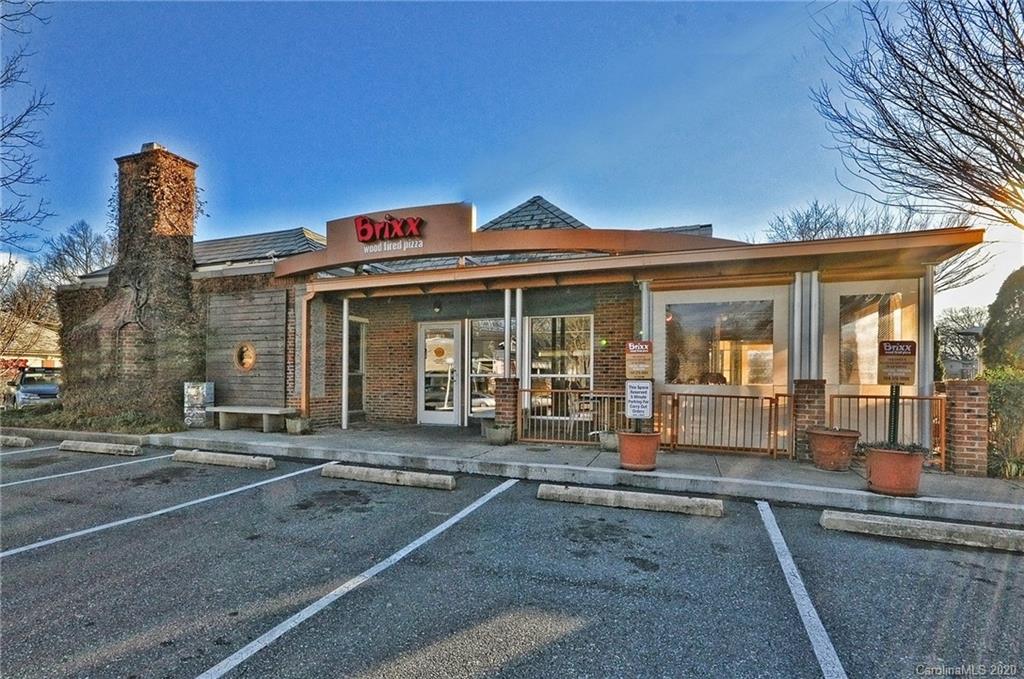 1501 Lilac Road Charlotte, NC 28209 - Photo 15 of 21 a front view of a building with glass windows