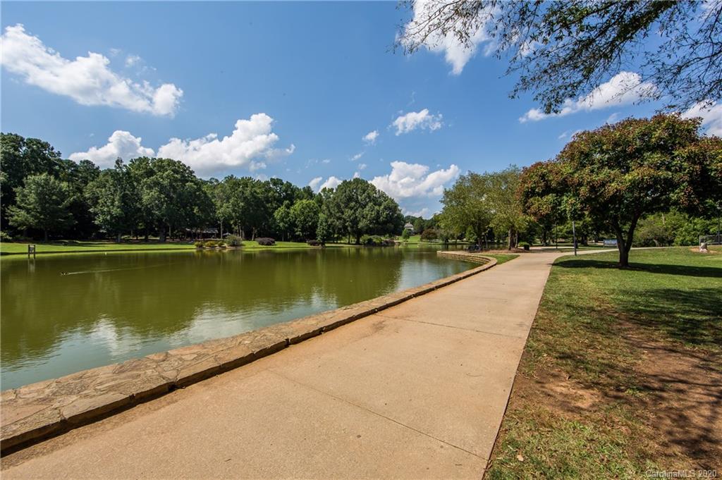 1501 Lilac Road Charlotte, NC 28209 - Photo 20 of 21 a view of a lake with a garden