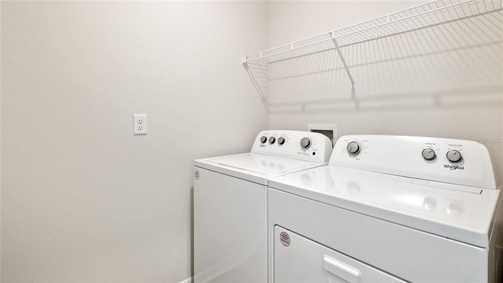 8808 Clear View Street Parrish, FL 34219 - Photo 14 of 16 a utility room with dryer and washer