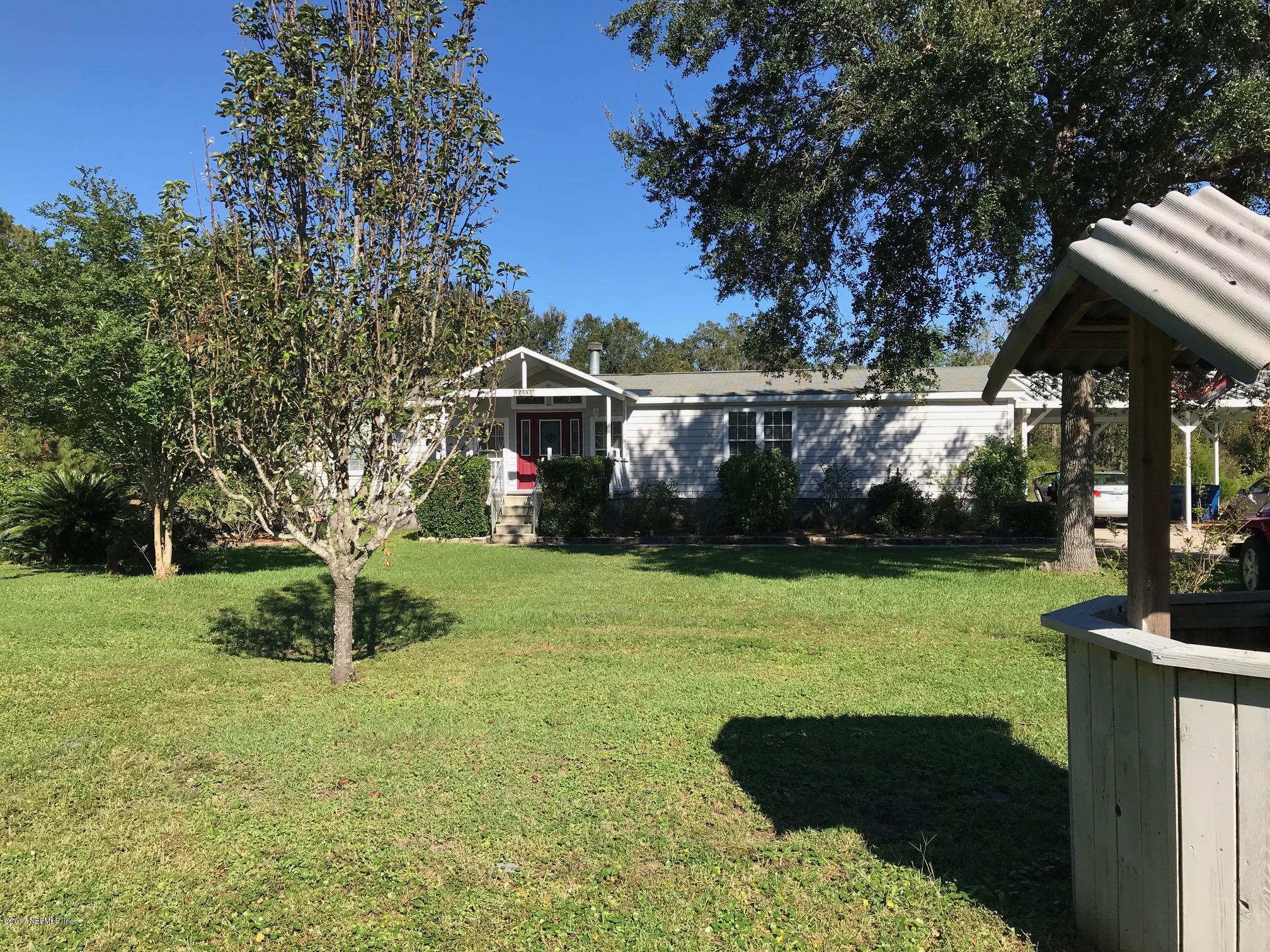 16113 Sawpit Road Jacksonville, FL 32226 - Photo 1 of 18 a view of a house with backyard and garden