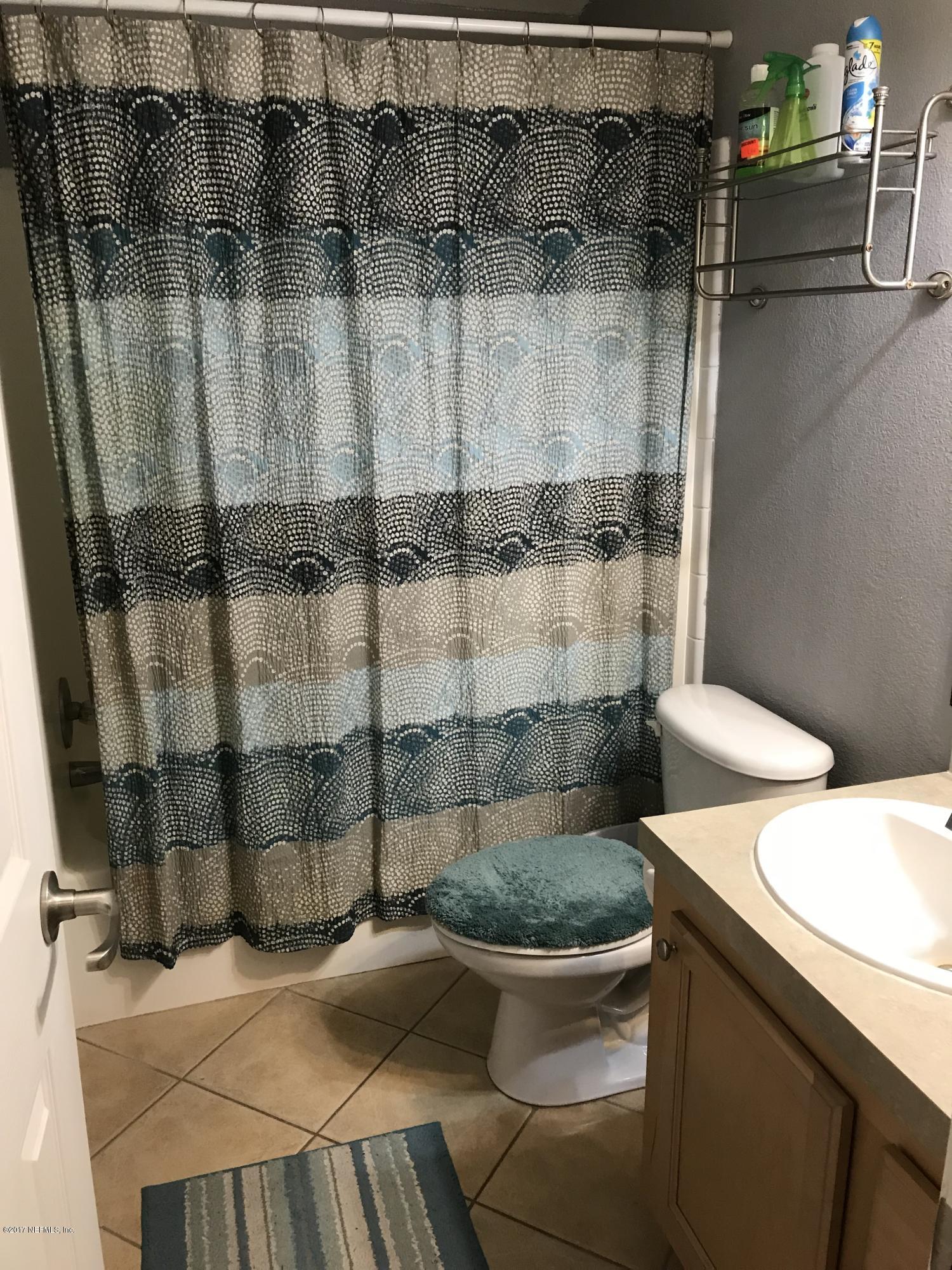 16113 Sawpit Road Jacksonville, FL 32226 - Photo 14 of 18 a bathroom with a sink toilet and shower