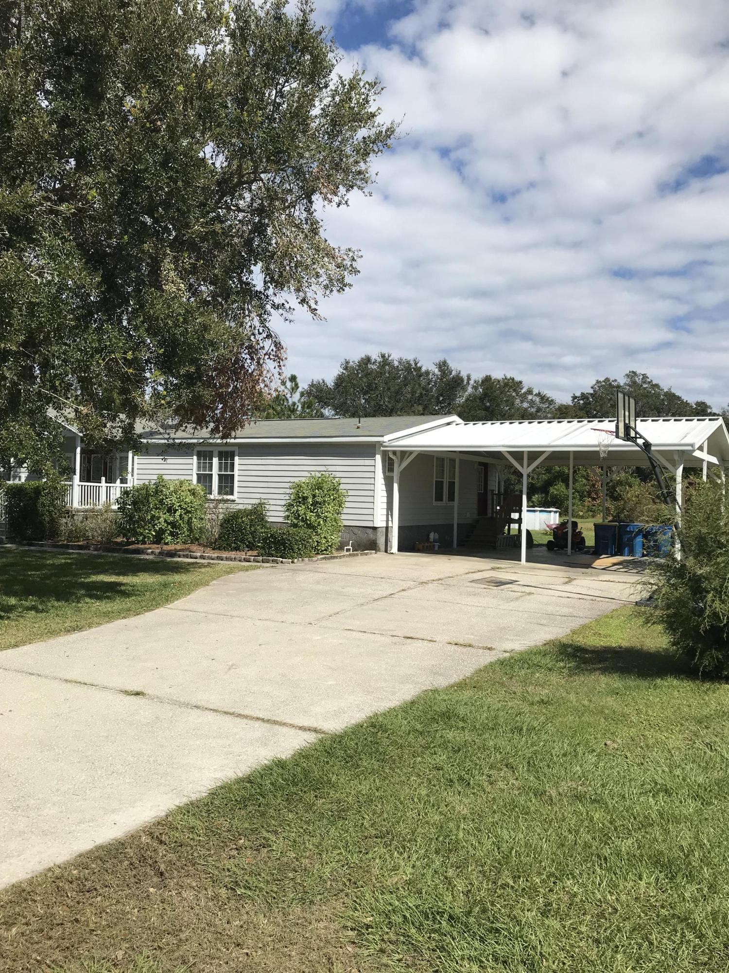 16113 Sawpit Road Jacksonville, FL 32226 - Photo 3 of 18 a view of a lake with houses