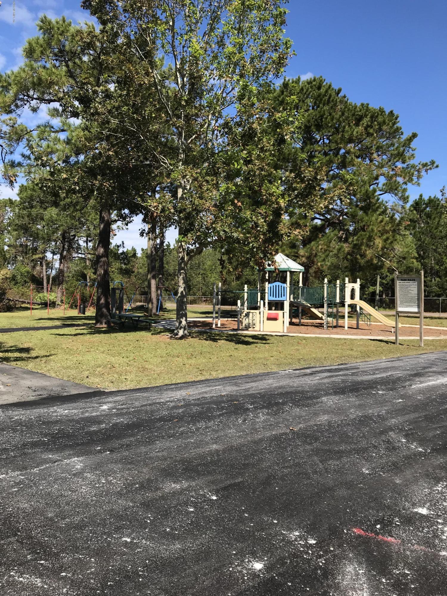 16113 Sawpit Road Jacksonville, FL 32226 - Photo 8 of 18 a building with trees in the background