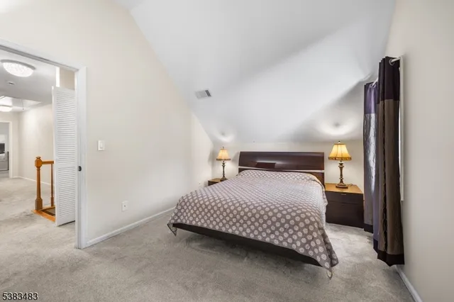 a bedroom with a bed and walk in closet