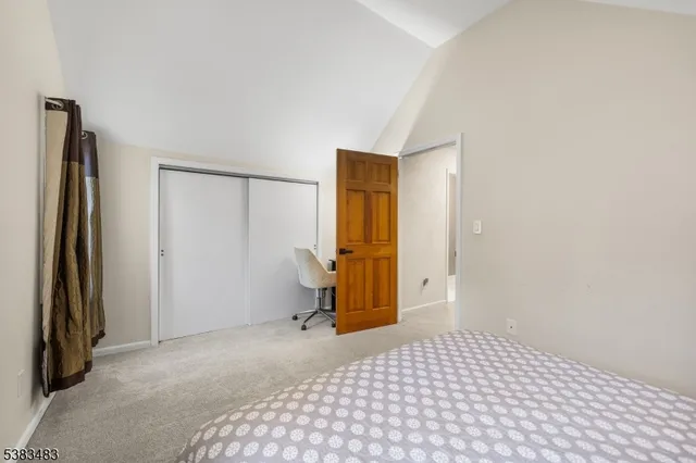 a bedroom with a bed and a table