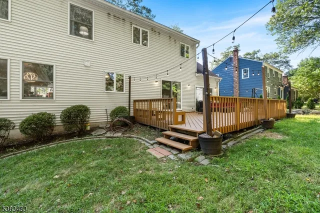 a backyard of a house with yard and trampoline