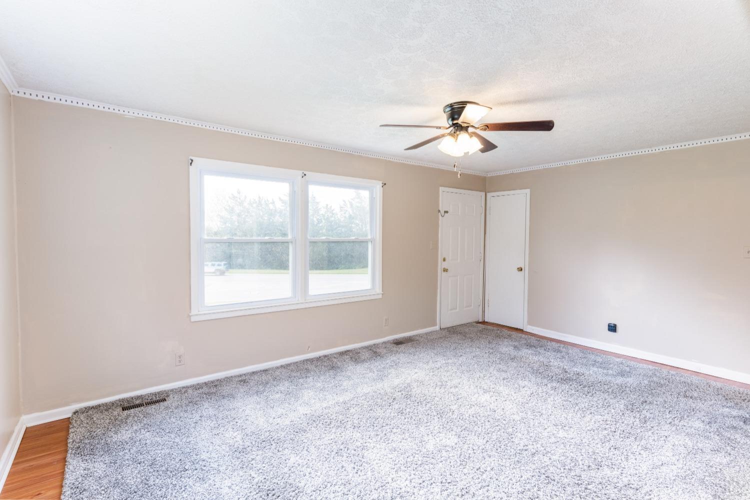 1040 Brookhill Road Forest, VA 24551 - Photo 3 of 27 a view of an empty room with a ceiling fan and window