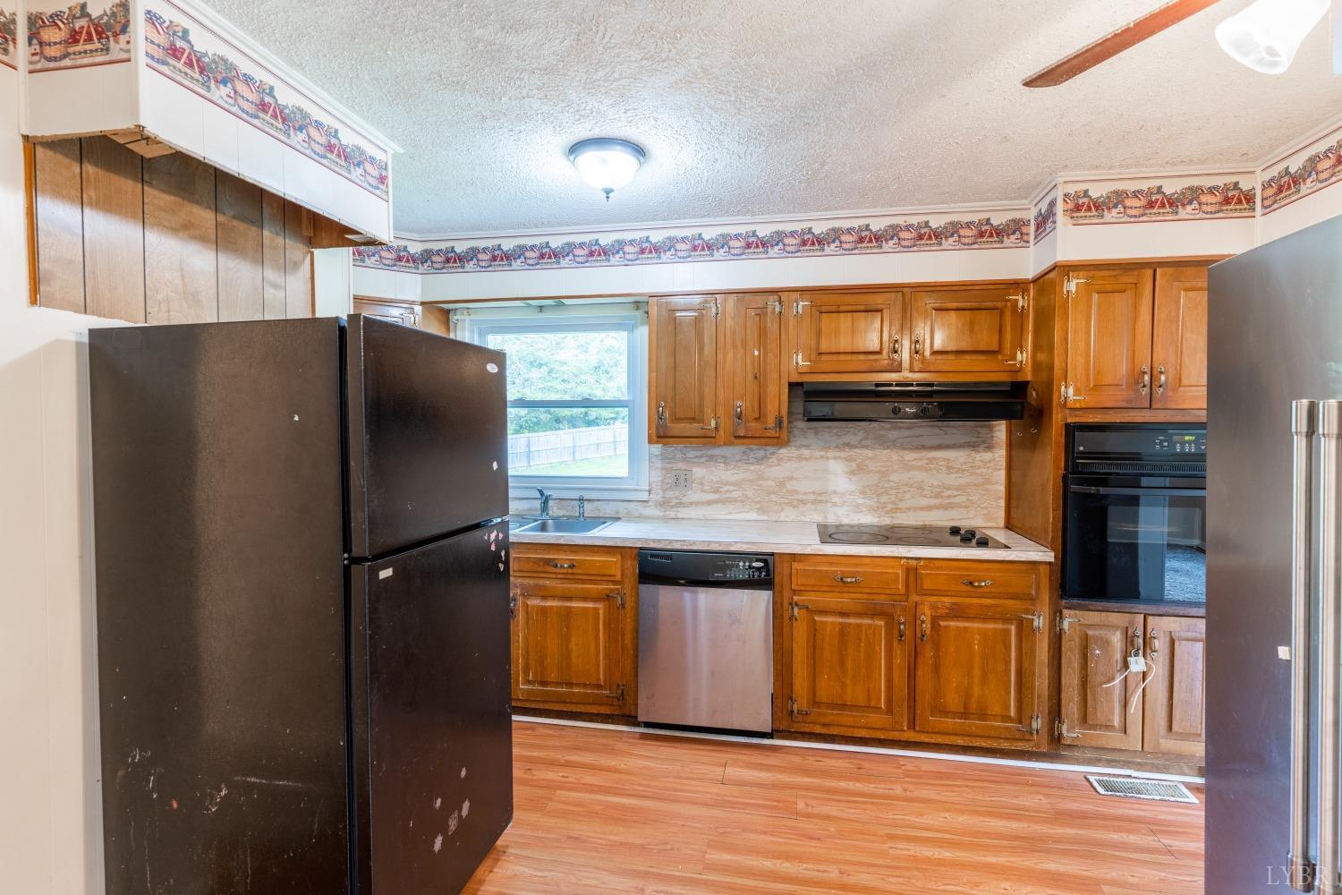 1040 Brookhill Road Forest, VA 24551 - Photo 5 of 27 a kitchen with stainless steel appliances granite countertop a refrigerator and a stove